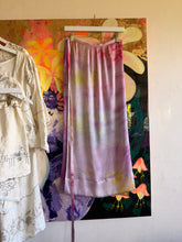 Load image into Gallery viewer, Hand-dyed lavender and pink wrap skirt with overlapping panel showing colorful pattern beneath