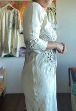 Load image into Gallery viewer, Full front view of bias-cut vintage tablecloth dress with floral motifs and pointed hem