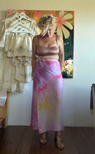 Load image into Gallery viewer, Model wearing the lavender, pink, and yellow hand-dyed cupro wrap skirt, front view