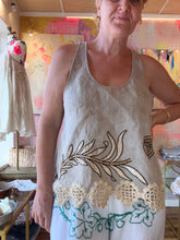 Load image into Gallery viewer, Back detail view showing crochet hem and embroidery