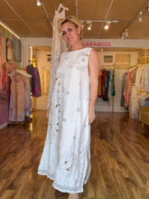 Load image into Gallery viewer, Detail shot — floral embroidery, cutwork openings and mirrored embellishments on ivory linen