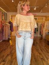 Load image into Gallery viewer, Front view of antique linen tablecloth top with hand embroidery and crochet lace trim