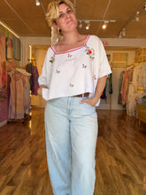 Load image into Gallery viewer, Model wearing vintage linen embroidered top, three-quarter view showing boxy silhouette