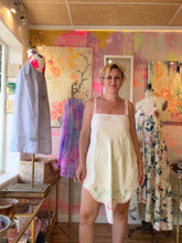 Load image into Gallery viewer, Model wearing vintage hand embroidered linen tablecloth dress, smiling