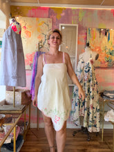 Load image into Gallery viewer, Front view of vintage hand embroidered linen tablecloth dress worn by model