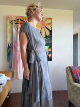 Load image into Gallery viewer, Close-up detail of side tie bows on hand-dyed cupro lurex pinstripe maxi dress