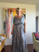 Load image into Gallery viewer, Front view of hand-dyed steel blue cupro lurex pinstripe maxi dress with side ties open
