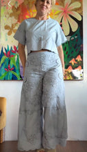 Load image into Gallery viewer, Front view of hand-dyed powder blue wide-leg pants paired with matching crop top