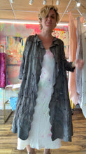 Load image into Gallery viewer, Closer back view of the chocolate-brown duster showing its cutwork textile and draped silhouette